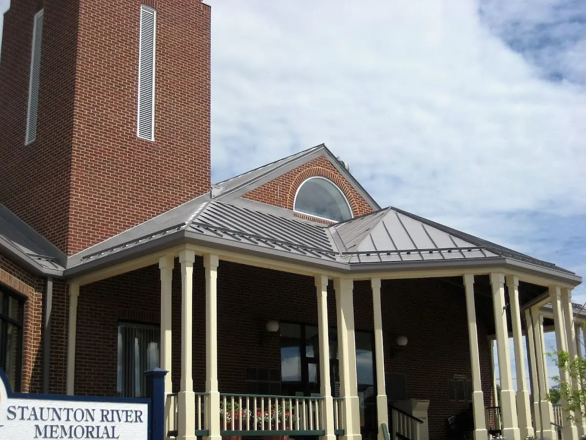 Skilled roofing craftsmen working on a residential roof in Summit - University